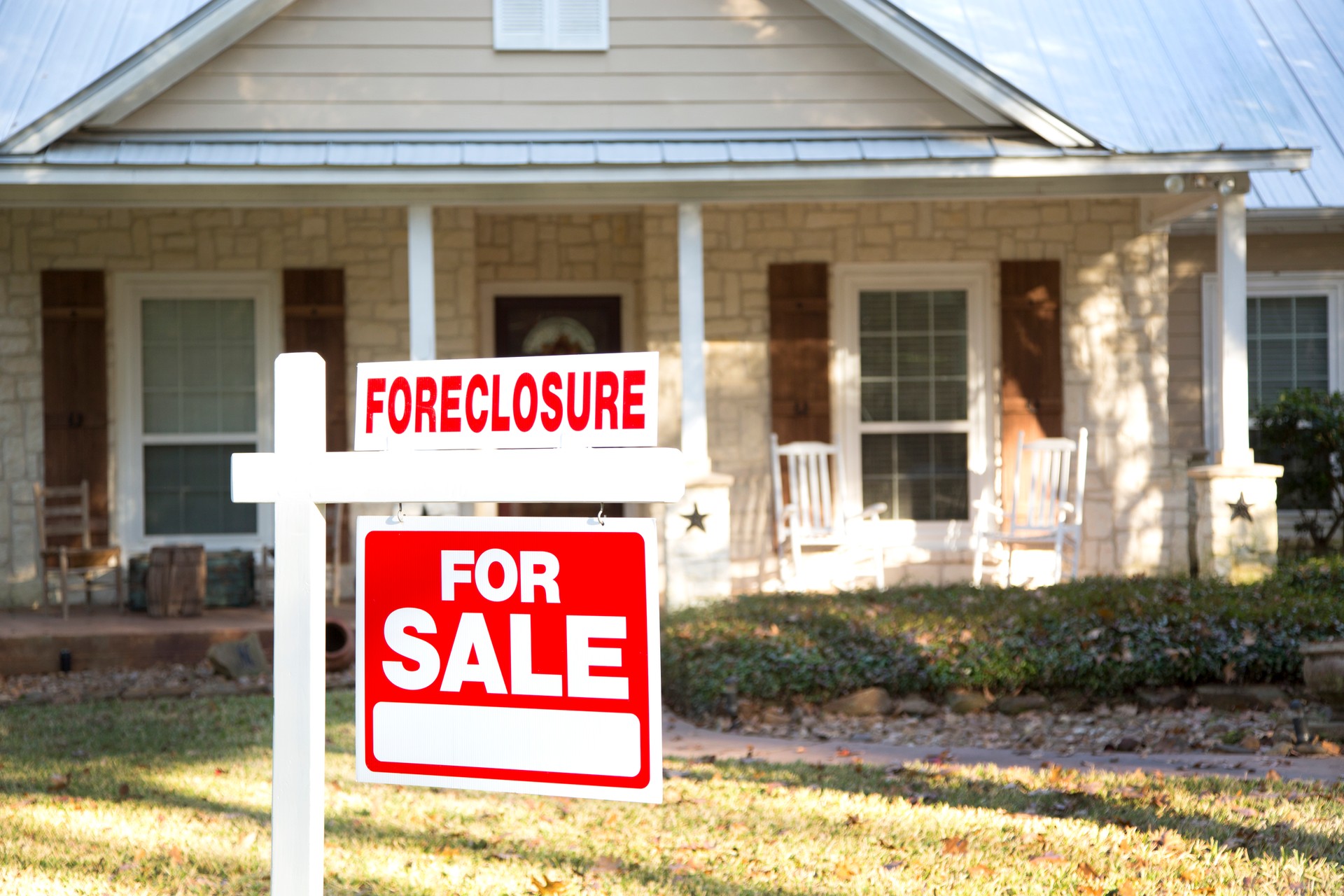 Home for sale with real estate sign.  Front Yard.